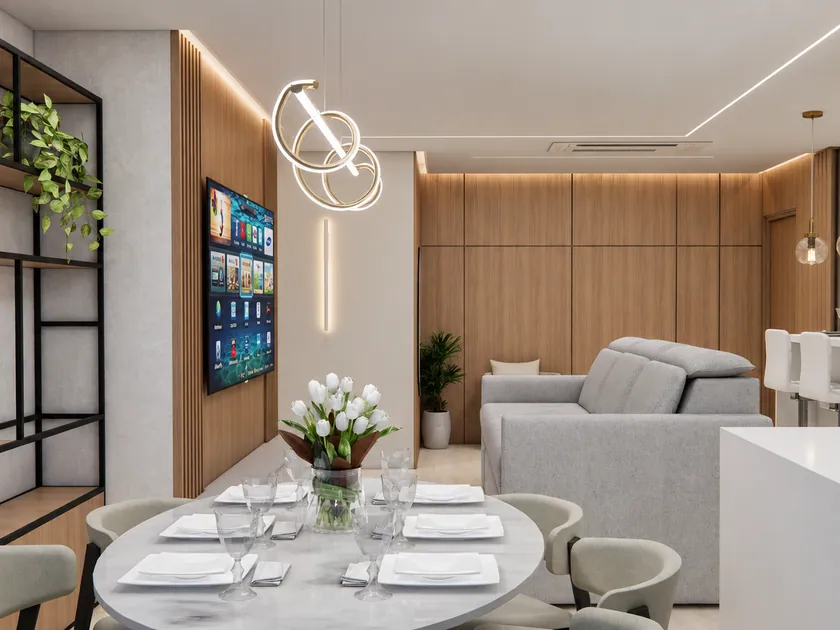 Perspectiva da sala integrada com mesa de jantar e iluminação decorativa